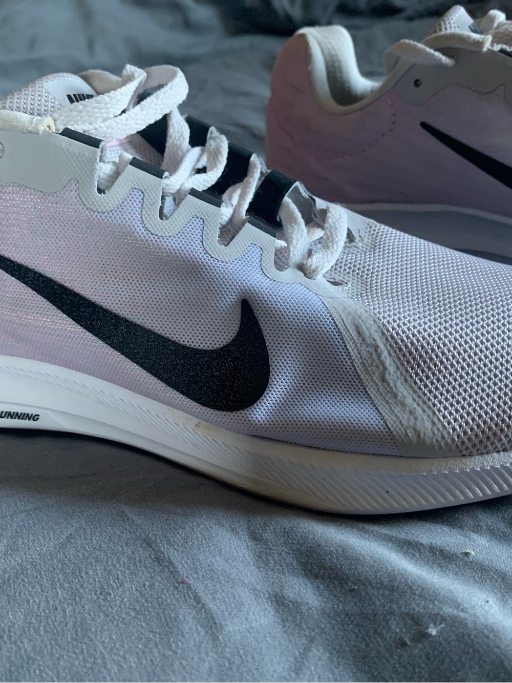 Nike Women’s White Athletic Running Shoes with Black Swoosh